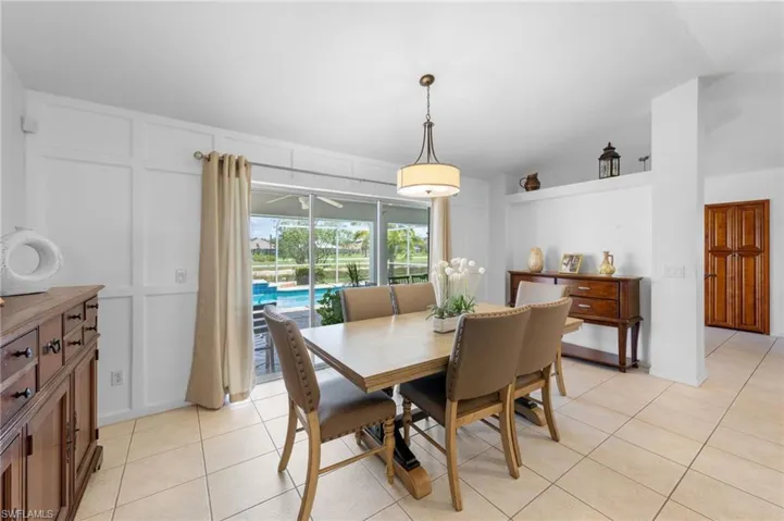 Dining space featuring light tile patterned floors