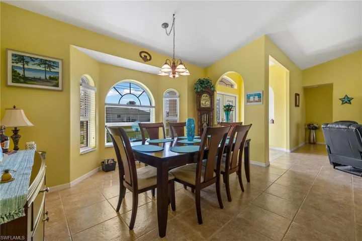Dining room featuring an inviting chandelier and light tile patterned floors