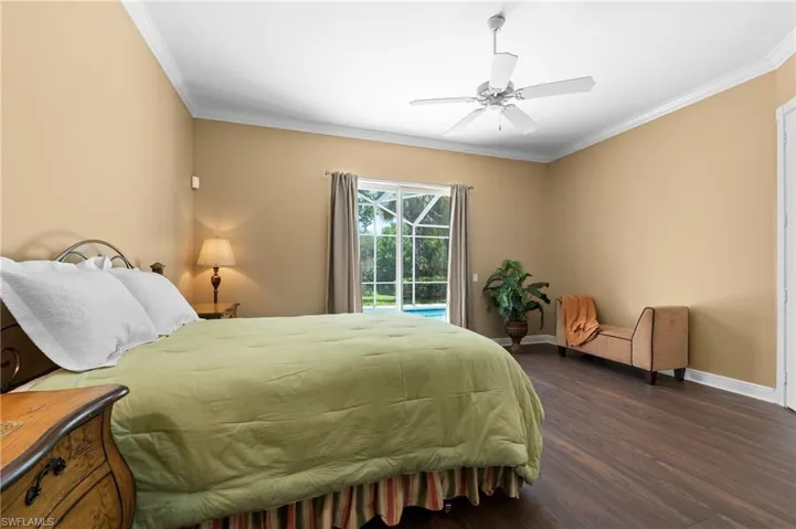 28311 Nautica Lane Bonita Springs FL 34135 - Owner's bedroom with impact slider access to pool deck