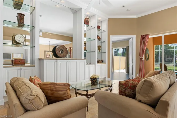 28311 Nautica Lane Bonita Springs FL 34135 - Living room with lighted wall unit with new soft close cabinets