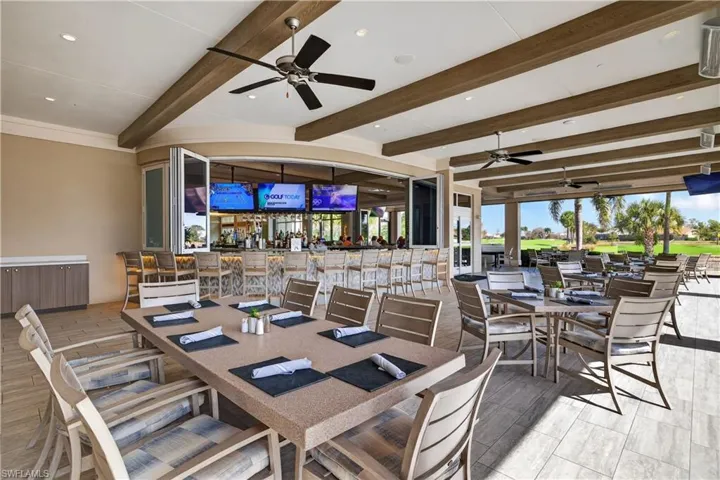 View of patio / terrace featuring outdoor dining space, a ceiling fan, and radiator heating unit