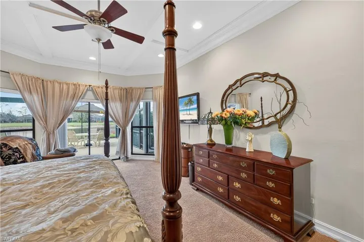 Bedroom featuring access to exterior, light colored carpet, a ceiling fan, and recessed lighting