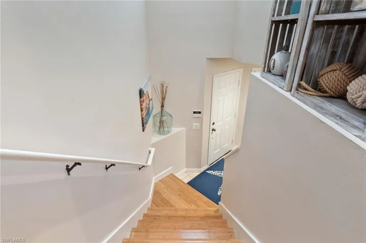 Staircase with hardwood / wood-style flooring