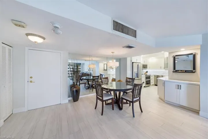 Dining space featuring light wood-style floors and baseboards