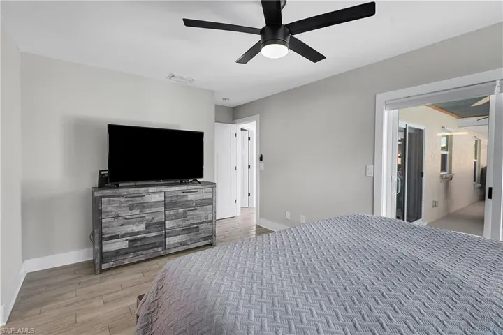 Bedroom featuring light wood-type flooring and ceiling fan