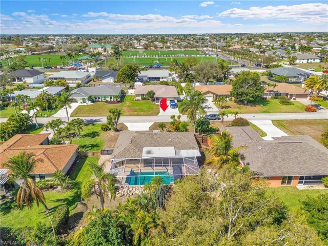 Aerial perspective of suburban area featuring a pool area
