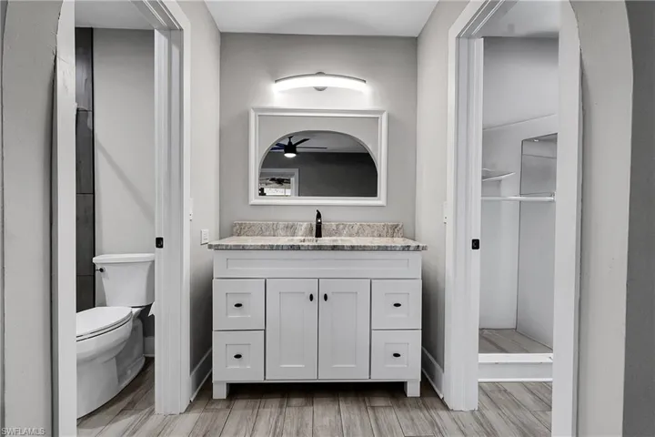 Bathroom with vanity and light wood-style flooring