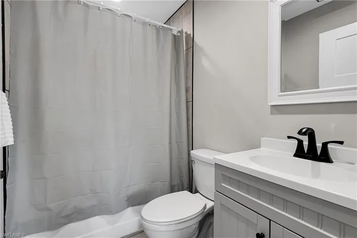 Bathroom featuring vanity and a shower with shower curtain