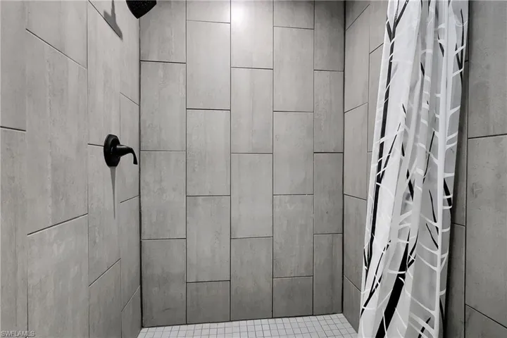 Bathroom featuring a shower stall
