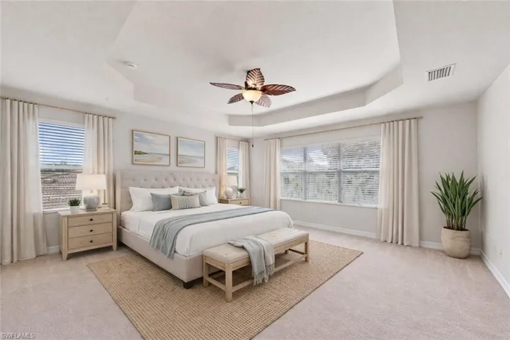 virtually staged primary bedroom.