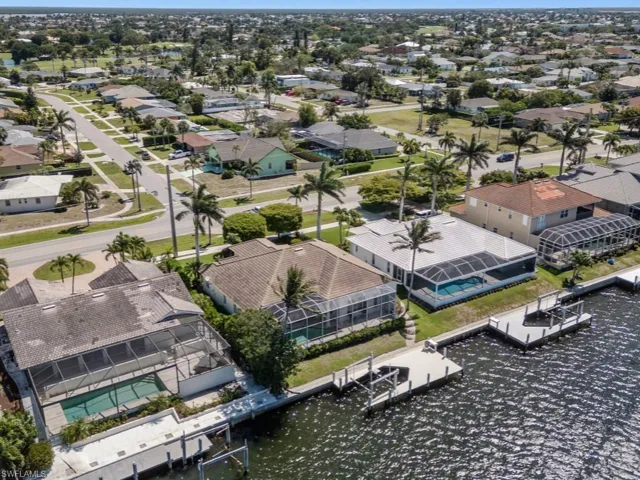 Bird's eye view featuring a water view and a residential view