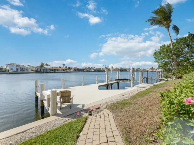 View of dock with a water view and boat lift