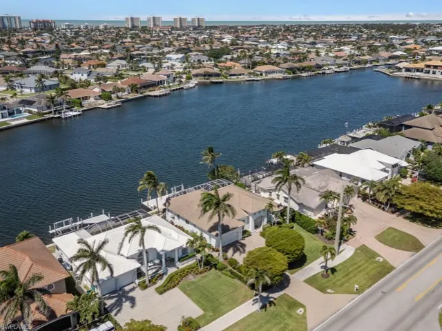 Aerial view featuring a water view and a residential view