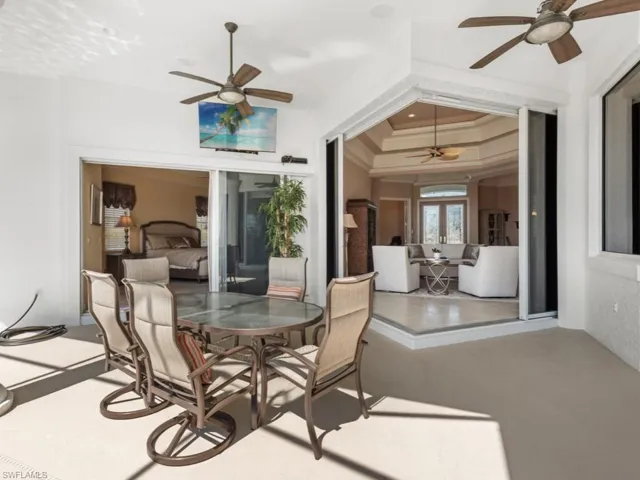View of patio / terrace featuring french doors, ceiling fan, and outdoor dining space
