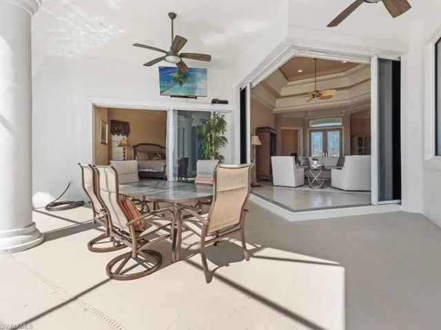 View of patio featuring outdoor dining space and ceiling fan
