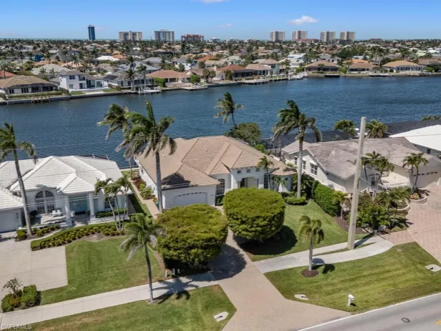 Aerial view featuring a residential view and a water view