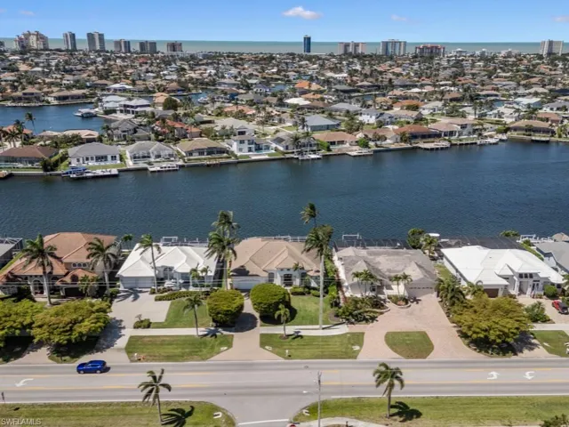 Birds eye view of property featuring a residential view and a water view