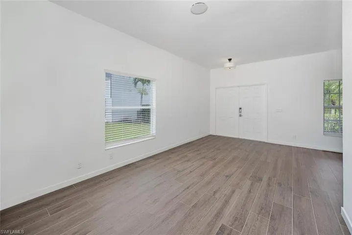 Unfurnished room with hardwood / wood-style flooring