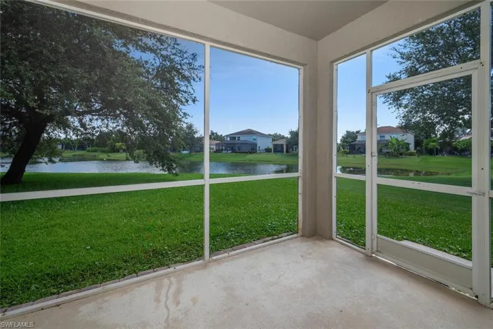 Unfurnished sunroom with a water view