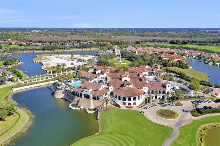 Aerial overview of property's location featuring a large body of water and nearby suburban area