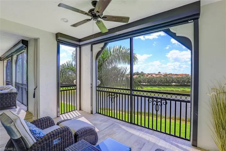Sunroom / solarium featuring a ceiling fan and wood finished floors