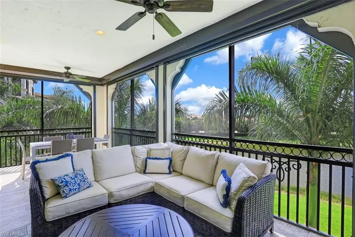 Sunroom featuring a ceiling fan and outdoor lounge area