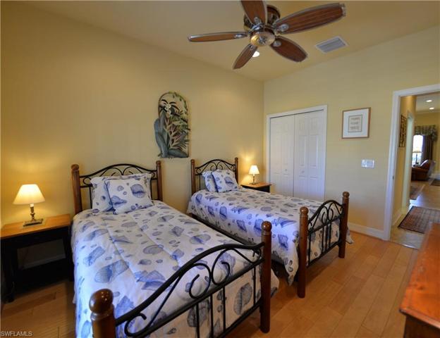 Spacious Guest Bedroom features Custom Wood flooring & Plantation Shutters.