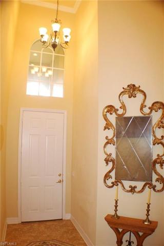 Entry Foyer with Volume Ceiling, Custom Crown Molding, Custom Tile Flooring, Upgraded Wood & Iron Banister and Elegant Wood Stairs with Custom Carpet Stair Tread Runner.