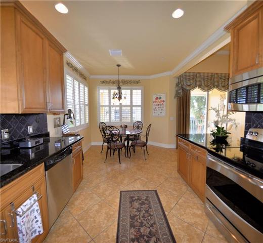 Kitchen features Lovely Maple wood cabinetry with 42" upper cabinets, Granite counters, Tile Backsplash, Spacious Breakfast room, Stainless appliances, Crown Molding, Plantation shutters and Lake Views!
