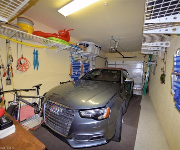 One Car Garage features ample storage shelving.