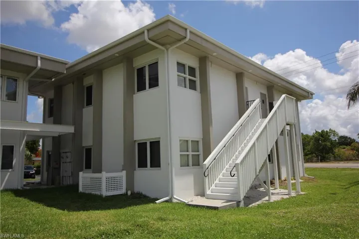 Rear view of property featuring a yard