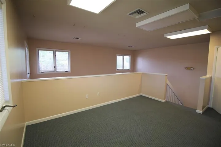 Carpeted empty room with plenty of natural light