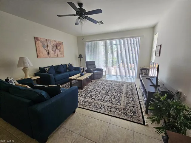 Tiled living room with ceiling fan