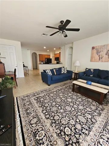 Tiled living room with ceiling fan