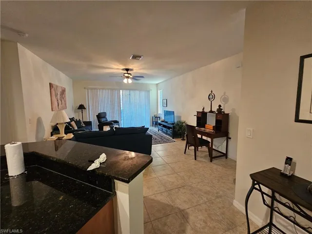 Tiled living room with ceiling fan