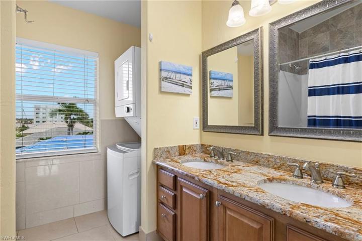 SECOND floor bathroom with washer/dryer stacked
