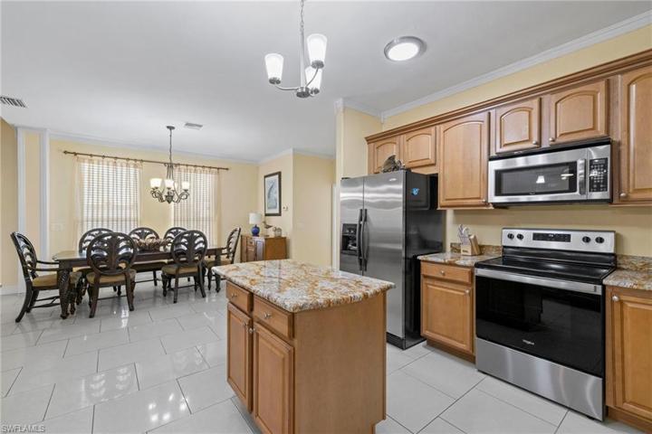 FIRST floor kitchen view with dining room in background
