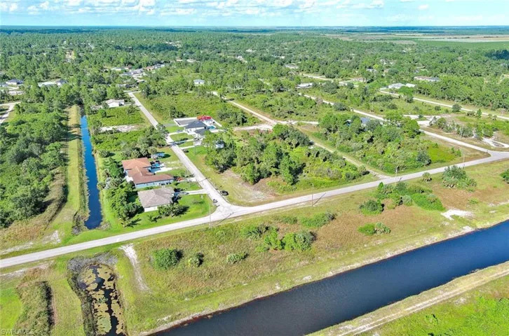 Aerial overview of property's location featuring a nearby body of water