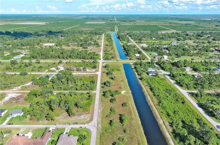 View of property location with a large body of water