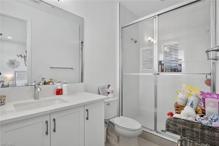Full bathroom featuring vanity and a stall shower