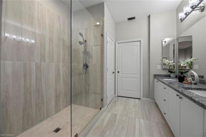 Master bath has oversized walk-in shower