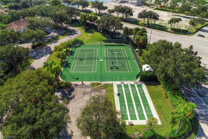 Ariel view of tennis court, pickelball court, and shuffleboard