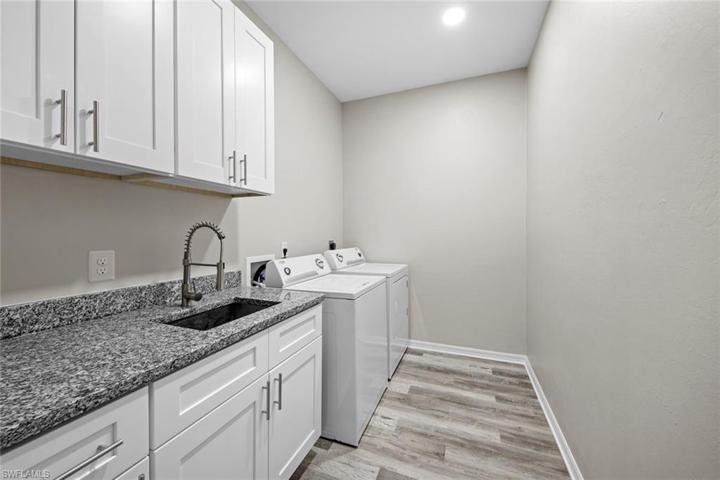 Laundry room w/sink, upper and lower cabinets