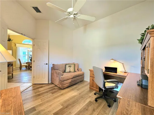 Office area featuring ceiling fan and light wood-type flooring