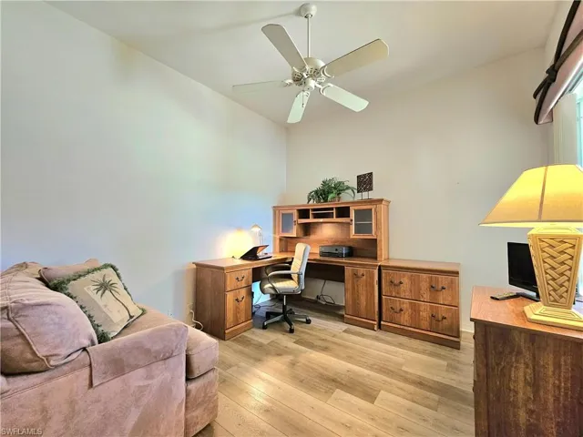 Office area featuring ceiling fan and light hardwood / wood-style floors