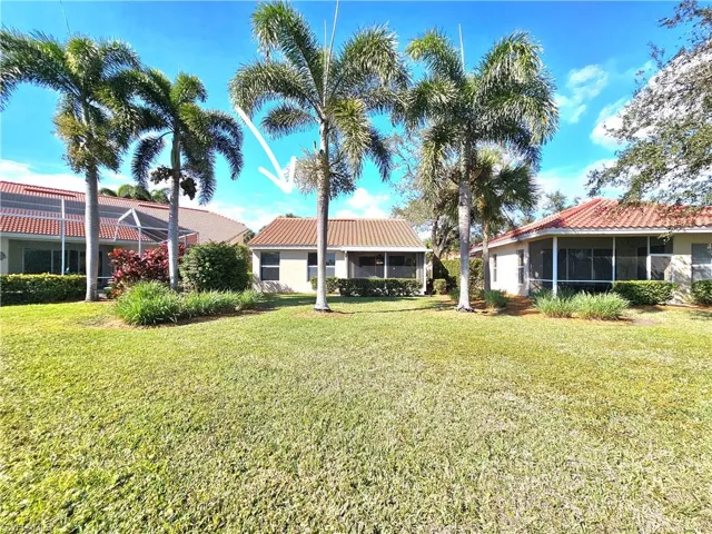 View of yard with a sunroom