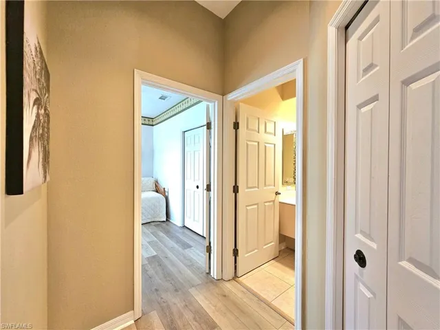 Corridor with light wood-type flooring