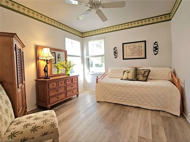 Bedroom featuring ceiling fan and light hardwood / wood-style flooring