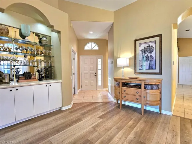Foyer entrance with light wood-type flooring