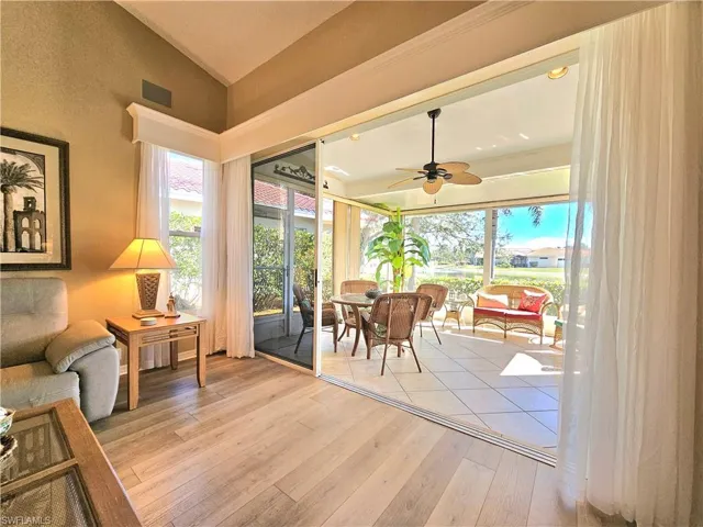 Sunroom featuring lofted ceiling and ceiling fan